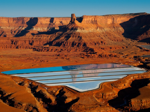 Water Treatment for Reuse the blue settling ponds of the Cane Creek Potash Mine near Moab, Utah.